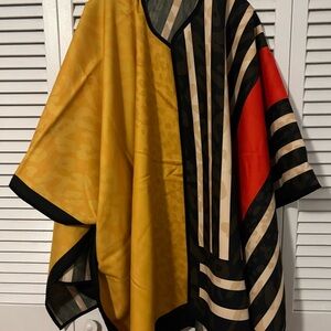 Sassy J poncho never used.free sized.